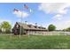 Spacious barn and farm buildings offer scenic views with white picket fences in a picturesque setting at 5121 Alysheba Dr, Indian Trail, NC 28079