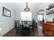 Formal dining room featuring a modern chandelier and elegant seating at 5121 Alysheba Dr, Indian Trail, NC 28079