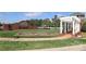 Community entrance with Bonterra sign, pergola, landscaped flower beds, and white fencing at 5121 Alysheba Dr, Indian Trail, NC 28079