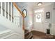 Welcoming entryway featuring tile flooring, staircase, and elegant decor at 5121 Alysheba Dr, Indian Trail, NC 28079