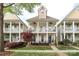 Charming two-story home with double porches, manicured landscaping, and inviting curb appeal at 5121 Alysheba Dr, Indian Trail, NC 28079