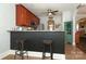 Stylish kitchen bar with dark wood paneling, bar stools, and ample countertop space at 5121 Alysheba Dr, Indian Trail, NC 28079
