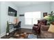 Inviting living room features hardwood floors, a desk with tv and comfortable seating for relaxing at 5121 Alysheba Dr, Indian Trail, NC 28079