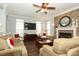 Spacious living room featuring a fireplace, TV, and comfortable seating arrangements at 5121 Alysheba Dr, Indian Trail, NC 28079