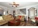 Cozy living room featuring hardwood floors, neutral paint, and ample seating at 5121 Alysheba Dr, Indian Trail, NC 28079