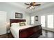 Spacious main bedroom boasts a tray ceiling, dark wood floors, and access to a balcony at 5121 Alysheba Dr, Indian Trail, NC 28079