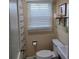 Cozy bathroom features a large window with blinds and a toilet at 526 Arlington Ave, Albemarle, NC 28001