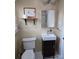 This bathroom has a modern sink, toilet, and an ornate shelf at 526 Arlington Ave, Albemarle, NC 28001