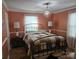 Bedroom featuring a decorative chandelier and a patterned quilt at 526 Arlington Ave, Albemarle, NC 28001