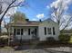 Charming single-story home with a covered front porch and mature trees in a quaint neighborhood at 526 Arlington Ave, Albemarle, NC 28001
