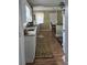 Efficient kitchen with granite countertops, white cabinetry, and hardwood floors at 526 Arlington Ave, Albemarle, NC 28001
