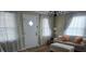 Inviting living room with a comfortable sofa, plush ottoman, and bright natural light at 526 Arlington Ave, Albemarle, NC 28001
