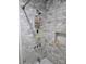 Close-up of a shower stall showcasing marble-patterned tiles and modern fixtures at 526 Arlington Ave, Albemarle, NC 28001