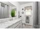 Bathroom featuring a vanity with a white basin sink, mirrored cabinets, and a shower at 5762 Hightower Rd, Fort Lawn, SC 29714