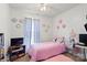 Bright bedroom with a ceiling fan, carpet, and a large window with soft-hued curtains at 5762 Hightower Rd, Fort Lawn, SC 29714