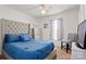 Charming bedroom features a ceiling fan, plush carpeting, and a sunlit window at 5762 Hightower Rd, Fort Lawn, SC 29714