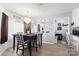 Dining area features modern chandelier, table with chairs and light-filled window with curtains at 5762 Hightower Rd, Fort Lawn, SC 29714