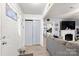 Inviting living area with a cozy fireplace, comfortable seating, and open view of the kitchen at 5762 Hightower Rd, Fort Lawn, SC 29714