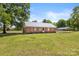 Single story brick home on a large lot with metal roof and a carport at 5762 Hightower Rd, Fort Lawn, SC 29714