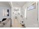 Bright hallway featuring light wood floors and neutral walls, leading into the home at 5762 Hightower Rd, Fort Lawn, SC 29714