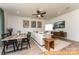 Open-concept living and dining area, featuring modern decor, neutral colors, and plenty of natural light at 6215 Honor Ave, Midland, NC 28107