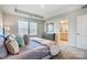 Bedroom view featuring tray ceilings and natural light at 6427 Mallow Crossing Ln, Charlotte, NC 28213