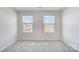 Empty bedroom showing natural light from two windows at 6427 Mallow Crossing Ln, Charlotte, NC 28213