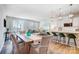 Open-concept space featuring a dining area adjacent to the living room and kitchen at 6427 Mallow Crossing Ln, Charlotte, NC 28213