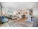 Bright open-concept space featuring a living room, dining area, and kitchen with modern finishes at 6427 Mallow Crossing Ln, Charlotte, NC 28213