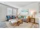 Cozy living room with neutral-toned furniture, area rug, and ample natural light at 6427 Mallow Crossing Ln, Charlotte, NC 28213