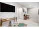 Loft space with desk, chair, and wall-mounted television at 6427 Mallow Crossing Ln, Charlotte, NC 28213