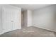 Cozy bedroom featuring ample storage with large closet space and neutral color palette at 7144 Hodges Meadow Ln, Charlotte, NC 28213