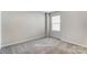 Bedroom featuring neutral carpet, light walls, and a large window letting in plenty of natural light at 7144 Hodges Meadow Ln, Charlotte, NC 28213