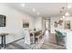 Open dining area with bench seating and view into kitchen at 7144 Hodges Meadow Ln, Charlotte, NC 28213
