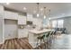 Stylish kitchen showcases an island, seating, and modern lighting at 7144 Hodges Meadow Ln, Charlotte, NC 28213