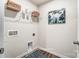 Laundry room with washer and dryer hookups and shelves for storage at 7144 Hodges Meadow Ln, Charlotte, NC 28213