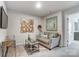 Cozy bonus room features a comfortable sofa, stylish decor, and a mounted television at 7144 Hodges Meadow Ln, Charlotte, NC 28213