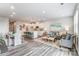 Open concept living space featuring modern kitchen, dining area, and living room with wood flooring at 7144 Hodges Meadow Ln, Charlotte, NC 28213