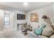 Cozy bonus room features a comfortable sofa, stylish decor, and a mounted television at 7144 Hodges Meadow Ln, Charlotte, NC 28213