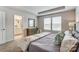 Inviting main bedroom boasting natural light, tray ceiling, and ensuite bathroom access at 7144 Hodges Meadow Ln, Charlotte, NC 28213