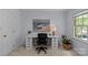 Home office features a desk with drawers and beach-themed artwork at 9607 Stoney Hill Ln, Charlotte, NC 28277