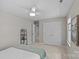 Calm bedroom featuring a bed with a green blanket, fan and closet at 9607 Stoney Hill Ln, Charlotte, NC 28277