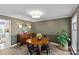 Dining room featuring a wooden table, modern chairs, and stylish wall coverings at 9607 Stoney Hill Ln, Charlotte, NC 28277