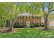 Charming brick two-story home with black shutters and a well-manicured front lawn at 9607 Stoney Hill Ln, Charlotte, NC 28277