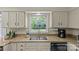 Classic kitchen featuring granite countertops, double sink, and modern appliances at 9607 Stoney Hill Ln, Charlotte, NC 28277