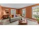 Comfortable living room featuring neutral tones, decorative accents, and wood-look flooring at 9607 Stoney Hill Ln, Charlotte, NC 28277