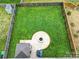 Aerial view of a well-manicured backyard featuring a fire pit, patio, lush lawn, and shed at 1018 Hinson Forest Rd, Monroe, NC 28110