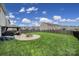 Expansive backyard featuring a stone fire pit, gazebo, and lush lawn, great for outdoor gatherings at 1018 Hinson Forest Rd, Monroe, NC 28110