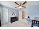 Cozy bedroom with a dark wood dresser, plush carpeting, and a comfortable armchair, perfect for relaxation at 1018 Hinson Forest Rd, Monroe, NC 28110