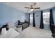 Charming bedroom featuring a crib, comfortable armchair, and ample natural light from the window at 1018 Hinson Forest Rd, Monroe, NC 28110